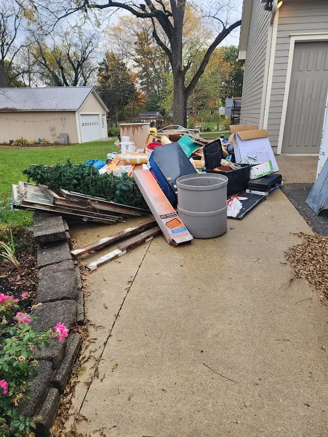 Dumpster being loaded with debris for 30 Yard Dumpster Rental in Four Corners